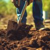 man shoveling topsoil close-up