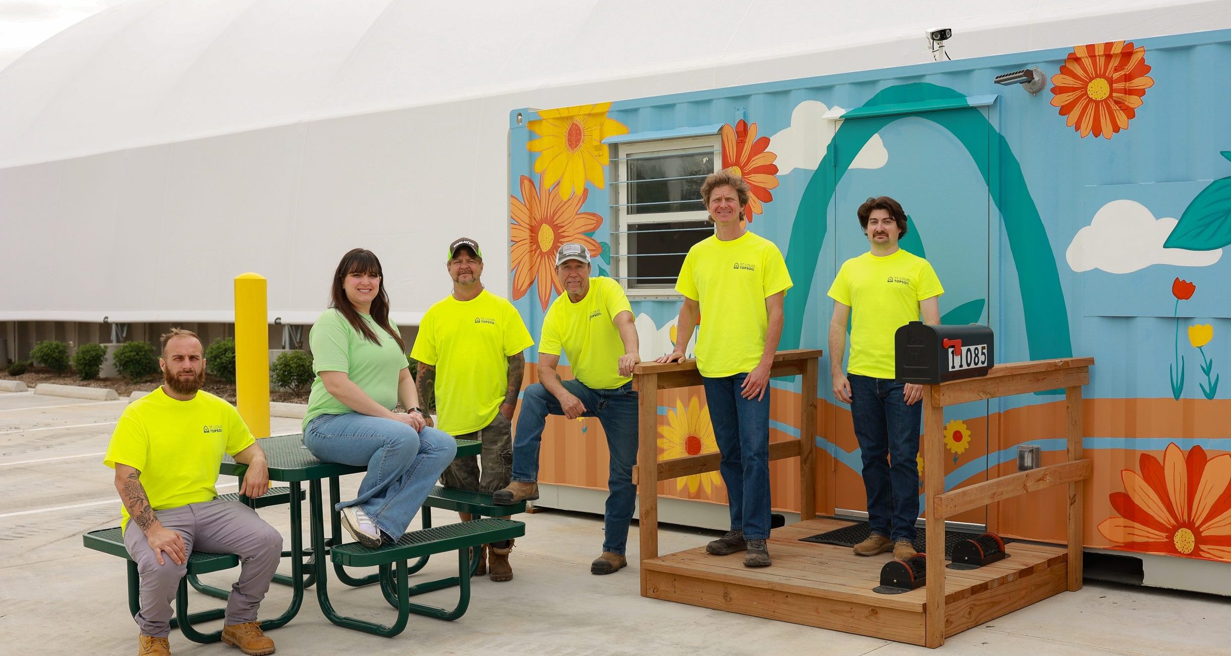 st louis topsoil delivery and customer team next to st louis topsoil painted office